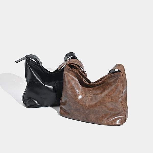 Lässig fallende Schulter-Tote-Bag in glänzender, Used-Lederoptik mit Reißverschluss oben und verstellbarem Riemen, Detailansicht 2