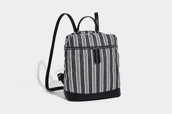 Small structured striped fabric backpack handbag with cream leather-look trim, top handle, and silver-tone hardware, detail