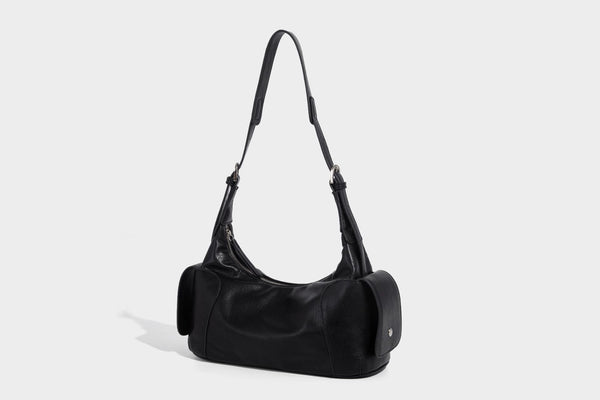 Soft pebbled leather-look hobo shoulder bag with zip top closure, side flap pockets, and silver-tone hardware, detail view 15