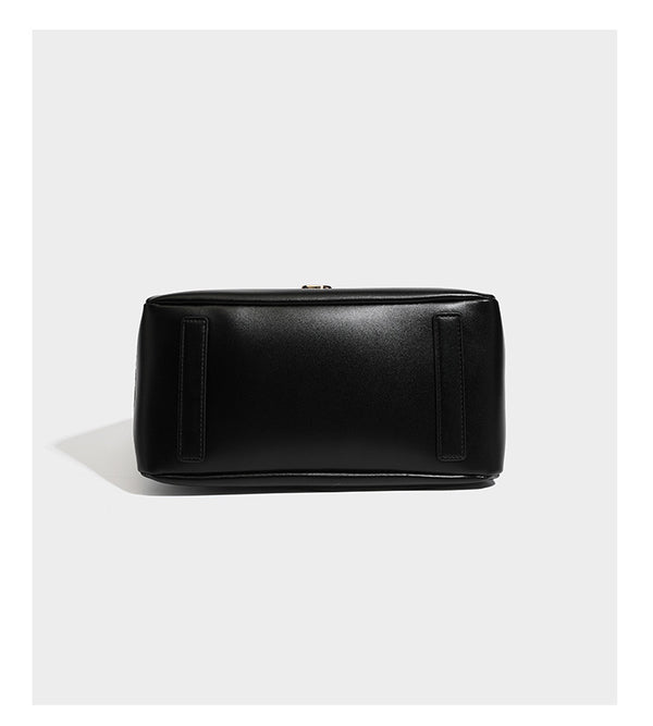 Structured glossy leather-look tote shoulder bag with dual top handles, detachable crossbody strap, side pockets, and, detail