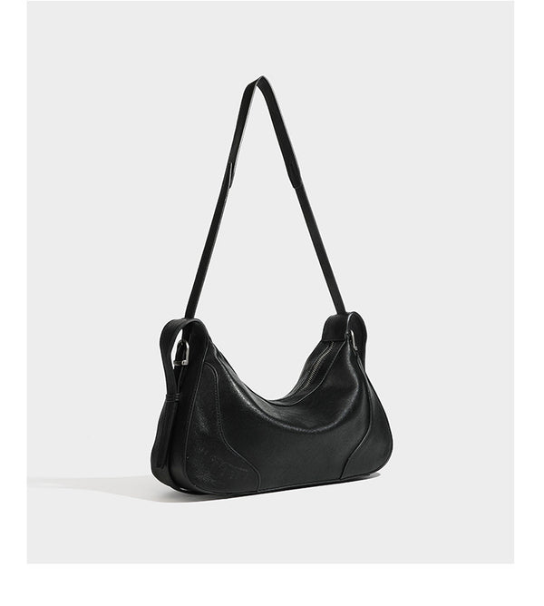 Slouchy crescent hobo shoulder bag in dark brown pebbled leather-look finish with zip top and long shoulder strap, detail