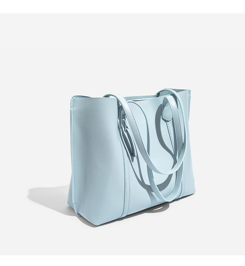 Large structured leather-look tote bag with belt-strap detail and gold-tone hardware, detail view 12