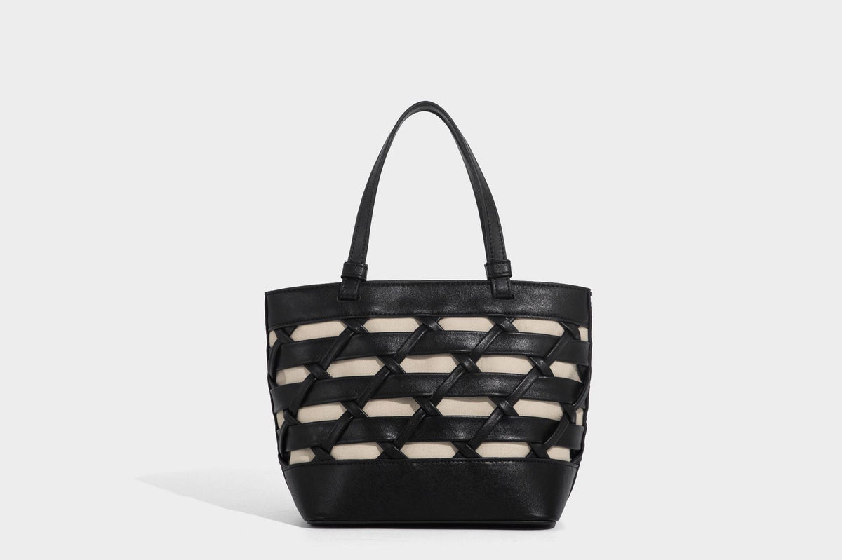Structured woven lattice tote bag with cream lining, dual top handles, detachable crossbody strap, and silver-tone hardware