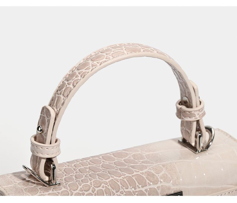 Croc-embossed mini top-handle satchel with silver turn-lock closure and adjustable crossbody strap, detail view 21