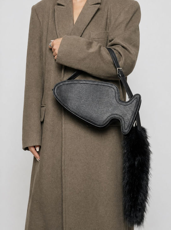Fish-shaped pebbled leather-look crossbody bag with black faux-fur tail accent and adjustable shoulder strap, detail view 8