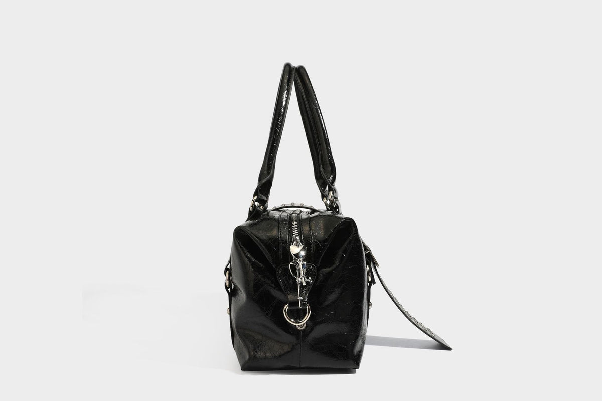 Glossy crinkled barrel handbag with silver stud buckle strap and detachable shoulder strap, detail view 27