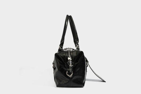 Glossy crinkled barrel handbag with silver stud buckle strap and detachable shoulder strap, detail view 27