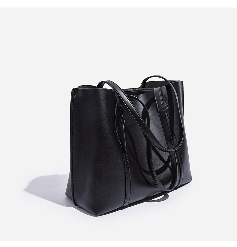 Large structured leather-look tote bag with belt-strap detail and gold-tone hardware, detail view 14