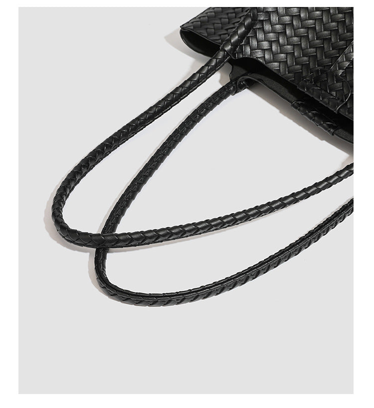 Large black basket-weave leather-look tote bag with long braided shoulder straps and matching woven zip pouch, detail view 22