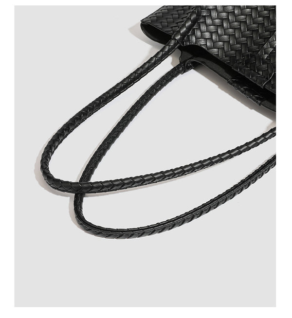 Large black basket-weave leather-look tote bag with long braided shoulder straps and matching woven zip pouch, detail view 22