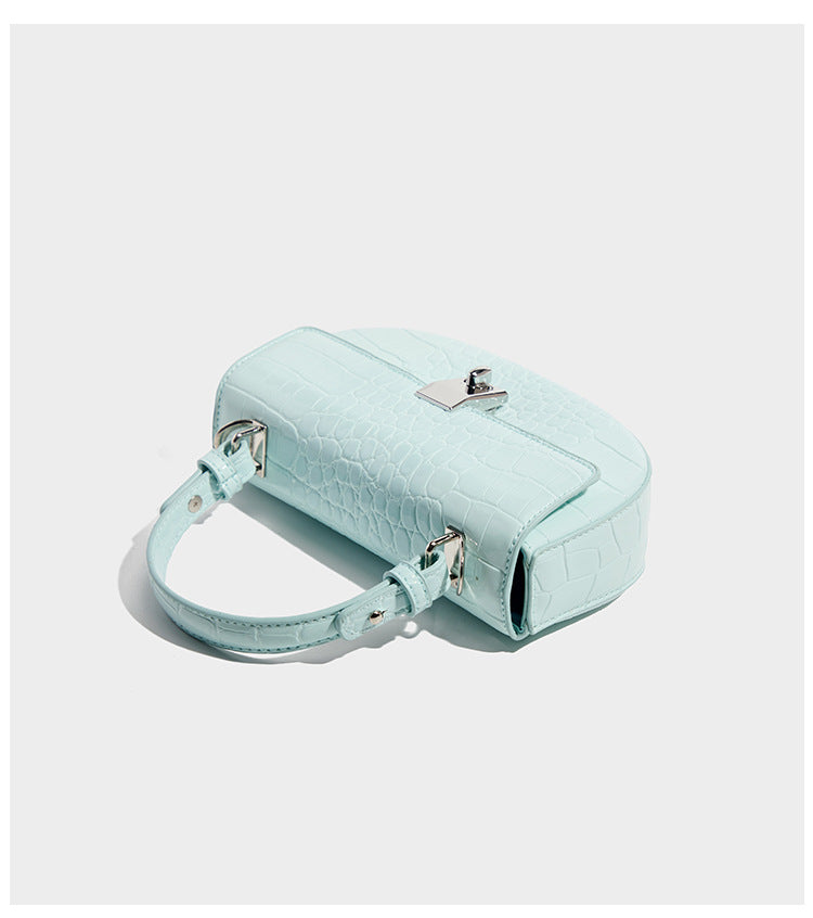 Glossy croc-embossed mini saddle bag with silver-tone turn-lock clasp and short top handle, detail view 8