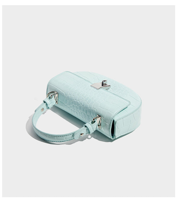 Glossy croc-embossed mini saddle bag with silver-tone turn-lock clasp and short top handle, detail view 8