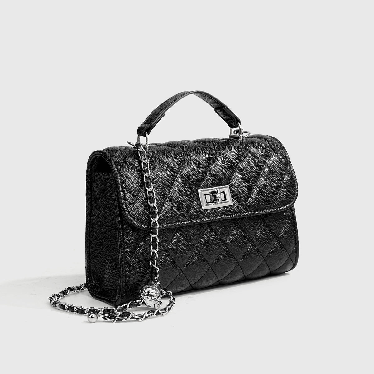 Small structured diamond-quilted flap satchel bag with silver-tone chain strap and turn-lock closure, detail view 3