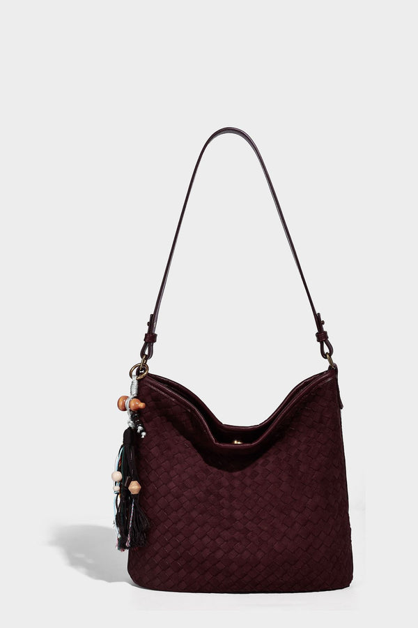 Dark chocolate woven texture hobo shoulder bag with multicolor tassel-and-bead charm and long adjustable strap, detail view