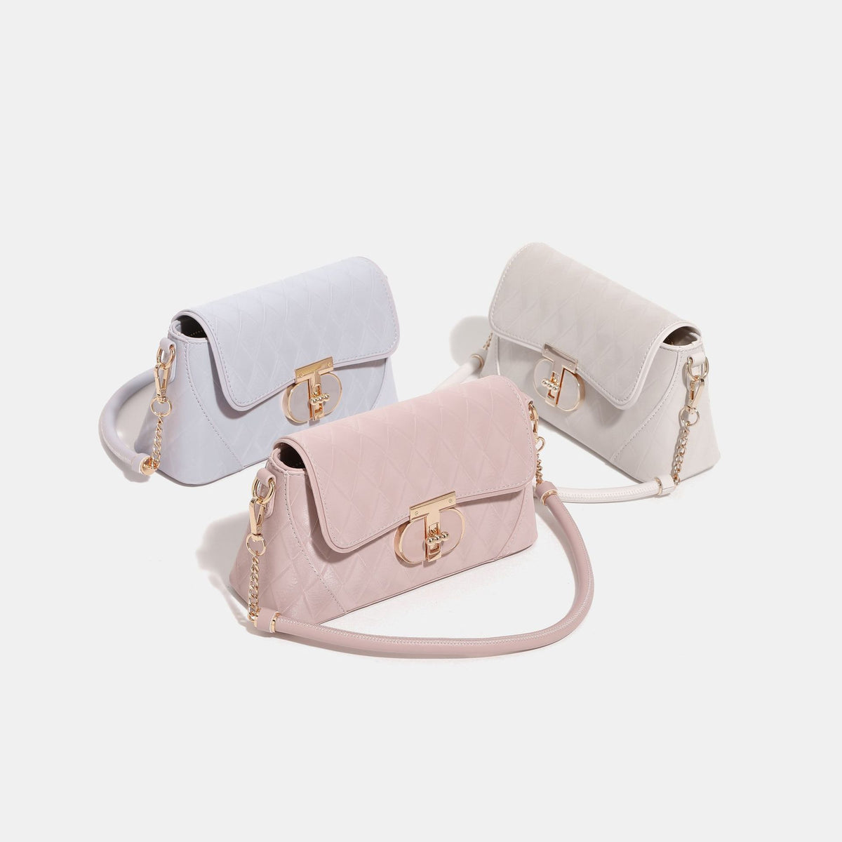 Quilted diamond-pattern flap bag with circular gold-tone turn-lock closure, chain shoulder strap, and tubular top handle
