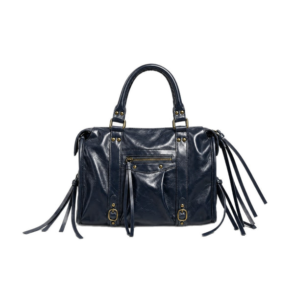 Structured glossy leather-look satchel bag with brass-tone studs, side tassel fringe, dual top handles, and front zip pocket