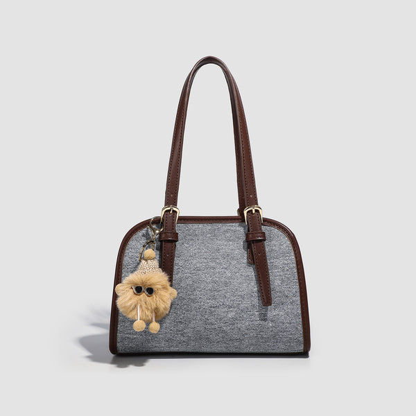 Small structured grey fabric shoulder bag with brown leather-look trim, gold-tone hardware, dual top handles, and detachable