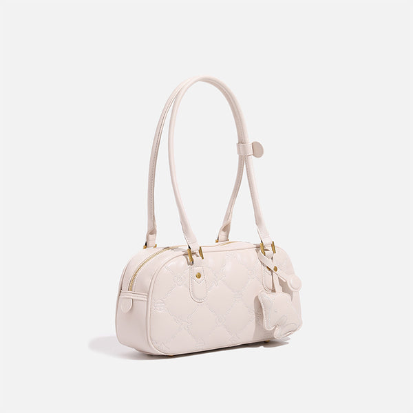 Small structured quilted leather-look zip shoulder bag with gold-tone hardware and adjustable strap, detail view 2
