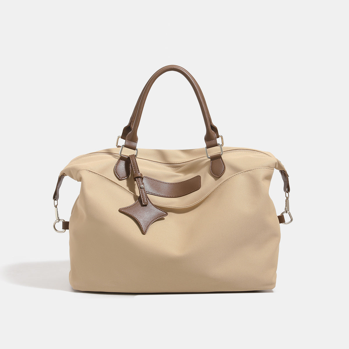 Large slouchy nylon tote bag with brown leather-look handles, double-pull zip closure, and star charm detail, front view
