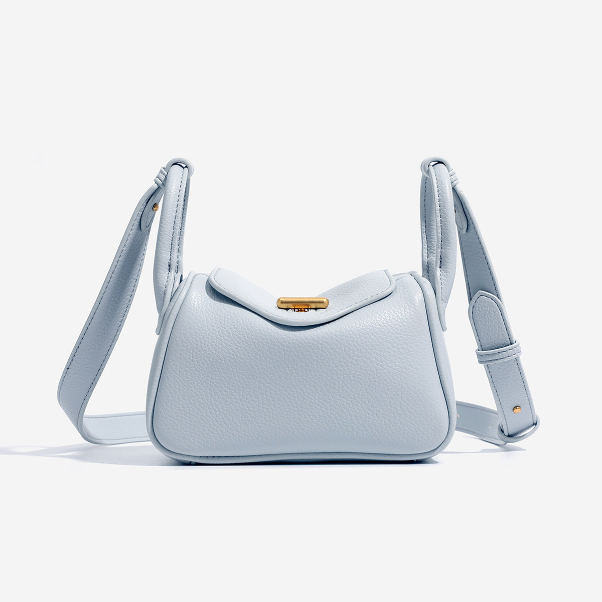 Mini structured flap shoulder bag in pebbled leather-look finish with gold-tone turn-lock closure and adjustable strap