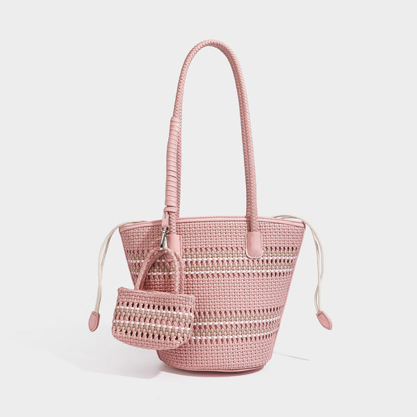 Structured woven bucket tote bag in pastel blue with braided shoulder strap, open lattice weave body, cream drawstring