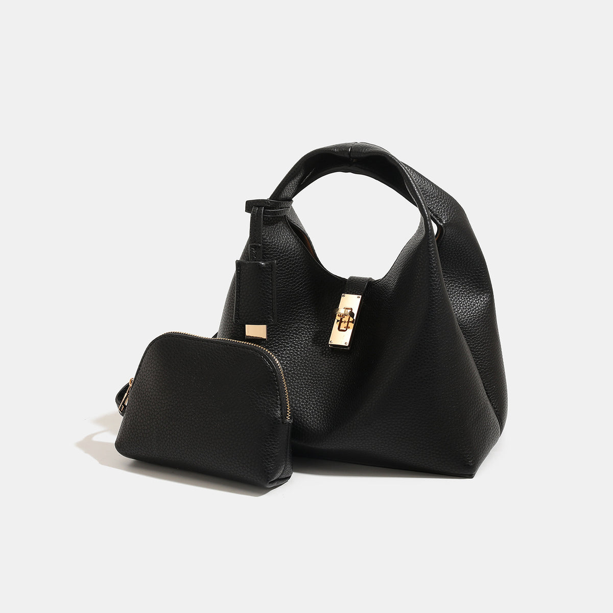 Structured pebbled leather-look bucket bag with gold-tone turn-lock clasp and looped top handle, detail view 3