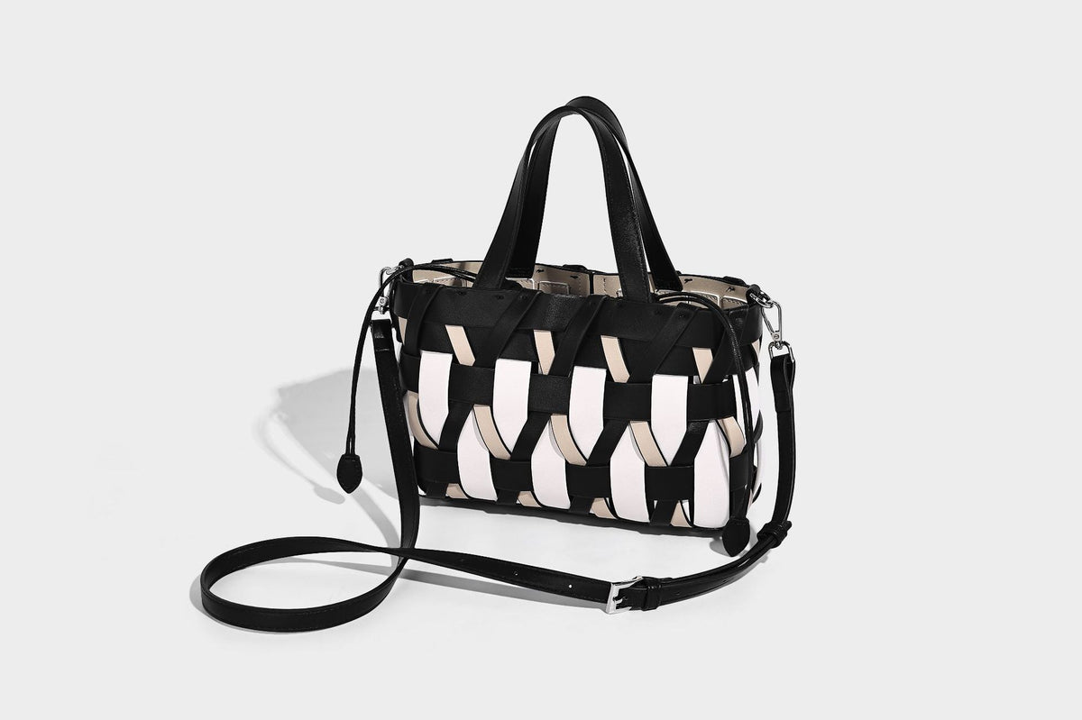 Small structured woven lattice tote bag with dual top handles and detachable shoulder strap in brown and cream leather-look