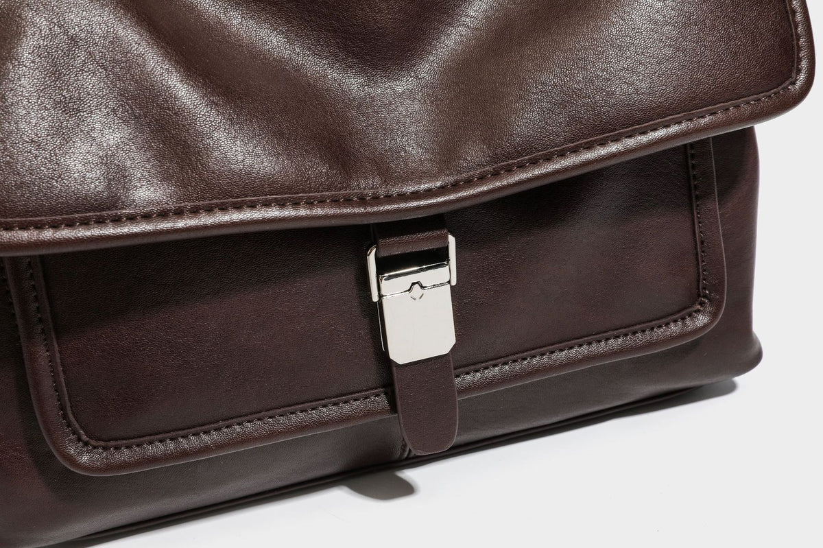 Structured rectangular satchel bag in dark espresso brown with smooth leather-look finish, flap front with silver turn-lock
