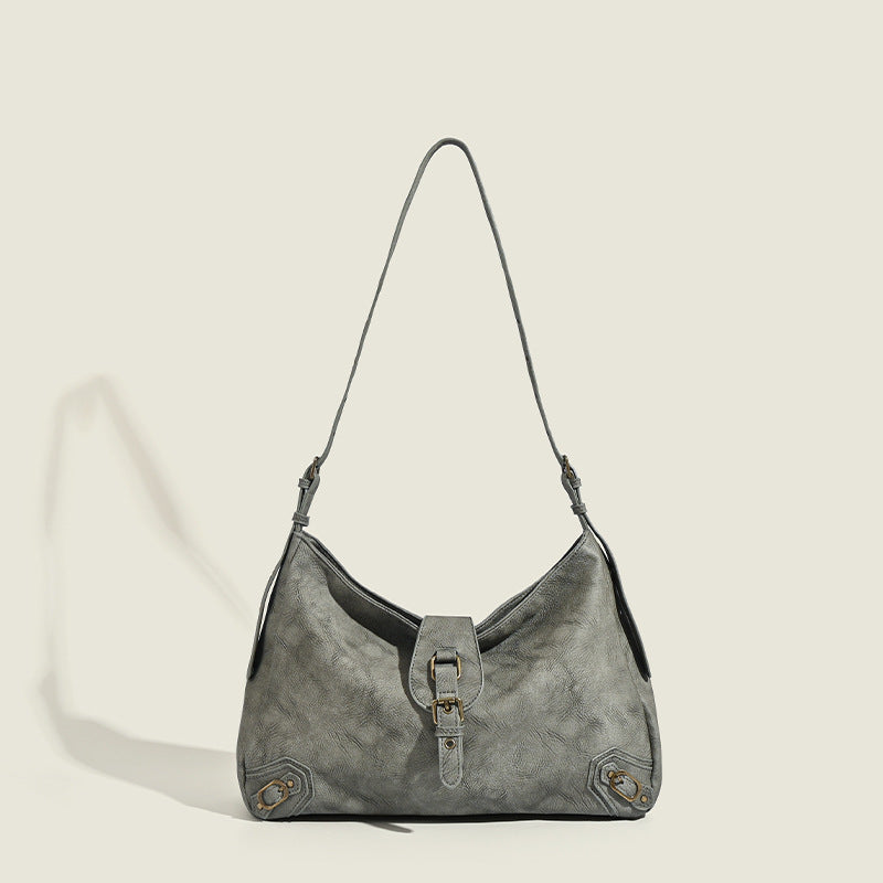 Slouchy distressed leather-look hobo bag with antique brass buckle closure and adjustable shoulder strap, detail view 7