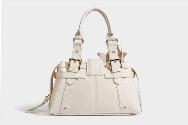 Structured leather-look satchel bag with heart padlock charm, star charm, gold-tone buckle hardware, dual top handles, and
