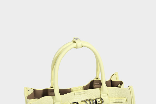Structured trapezoid tote bag in pebbled leather-look finish with double top handles, silver-tone bar hardware, and, detail