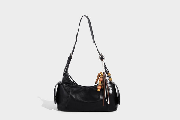 Soft pebbled leather-look hobo shoulder bag with zip top closure, side flap pockets, and silver-tone hardware, detail view 14