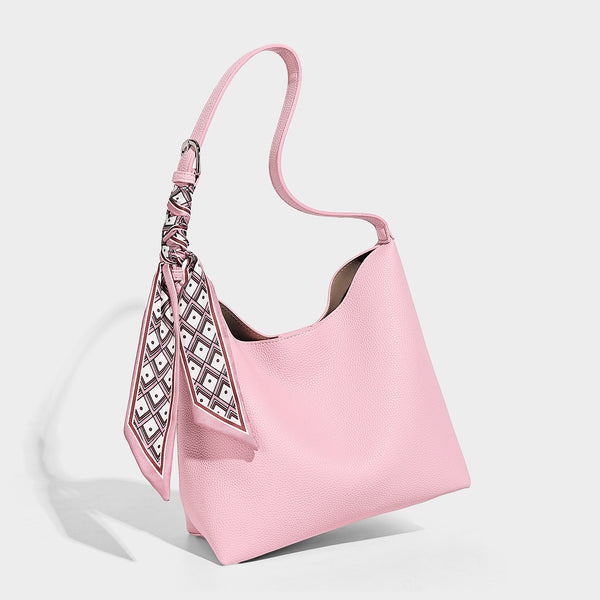 Soft slouchy hobo shoulder bag in pebbled matte finish with slim strap, silver-tone ring hardware, and knotted printed scarf