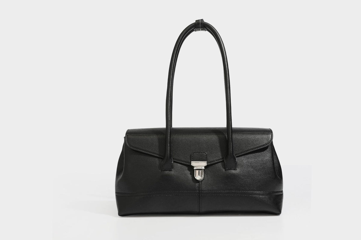 Structured rectangular satchel bag with dual rounded top handles and central metal turn-lock flap closure, detail view 19