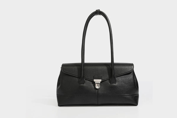 Structured rectangular satchel bag with dual rounded top handles and central metal turn-lock flap closure, detail view 19