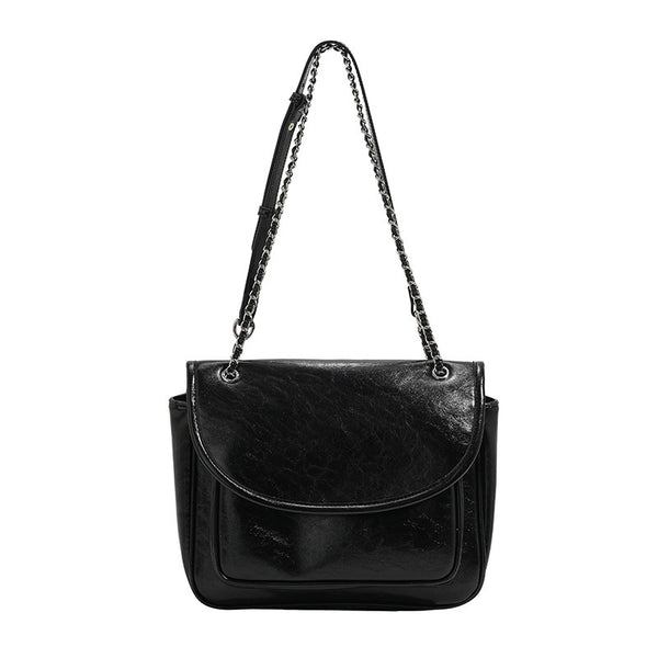 Structured glossy leather-look flap crossbody satchel with woven chain-and-leather shoulder strap, detail view 5