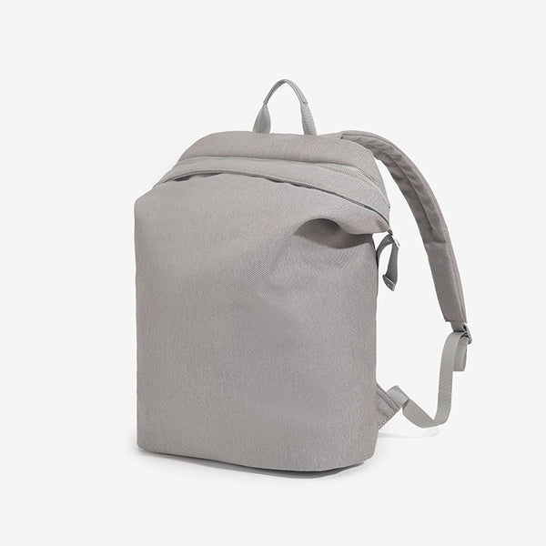 Structured matte nylon backpack with top zip closure, front zip pocket, top carry handle, and adjustable shoulder straps
