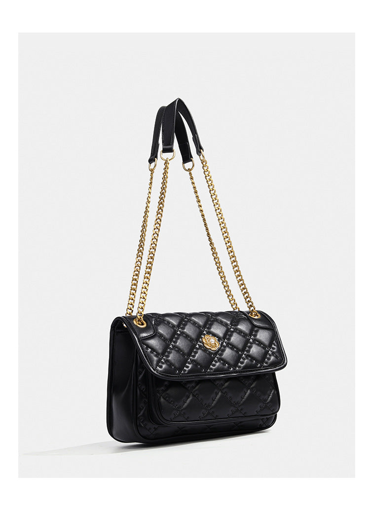 Compact diamond-quilted flap shoulder bag with gold-tone chain strap and floral turn-lock clasp, detail view 13