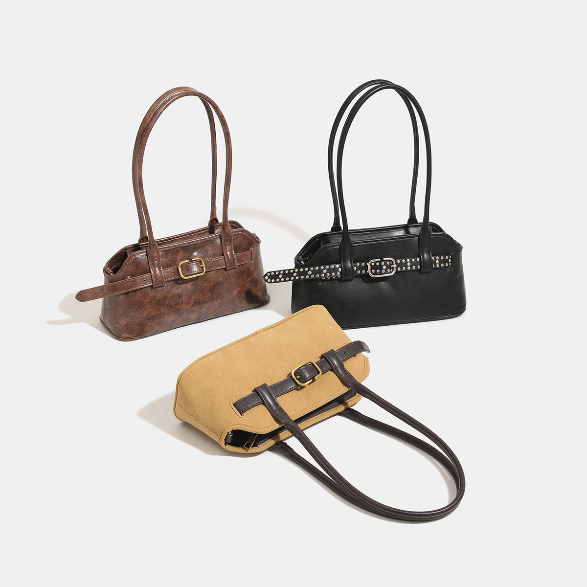 Kleine strukturierte Retro-Schultertasche mit Schnallendetail am Riemen, zwei Tragegriffen und goldfarbenen Beschlägen, Detailansicht 2