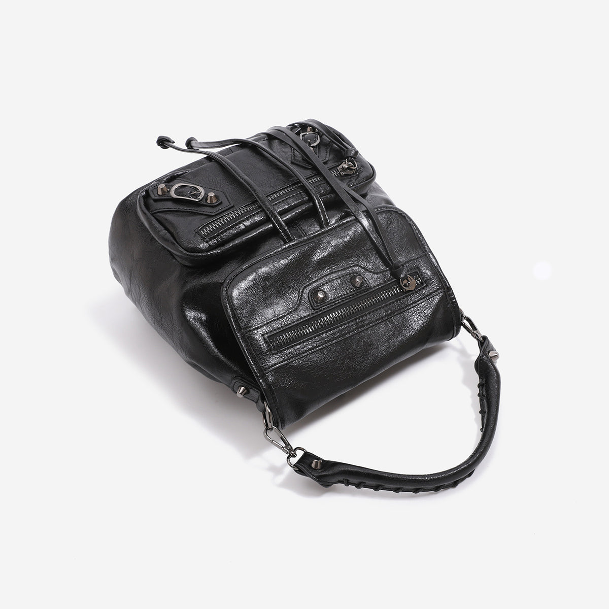 Mini flap backpack handbag with silver stud hardware, front zip pockets, and drawstring tassels, detail view 4