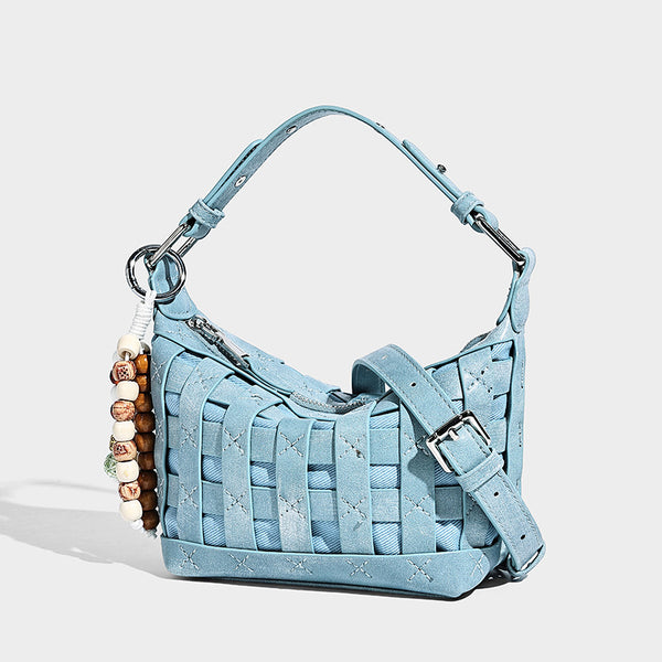 Small woven convertible shoulder bag with top zipper, silver-tone hardware, and detachable crossbody strap, front view