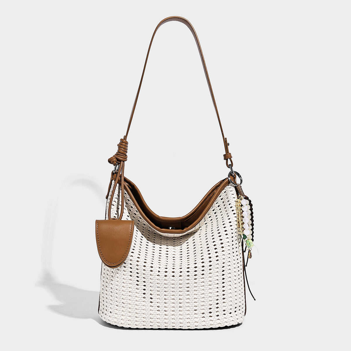 Slouchy open-weave hobo shoulder bag with leather-look trim, beaded tassel charm, and adjustable strap, detail view 3