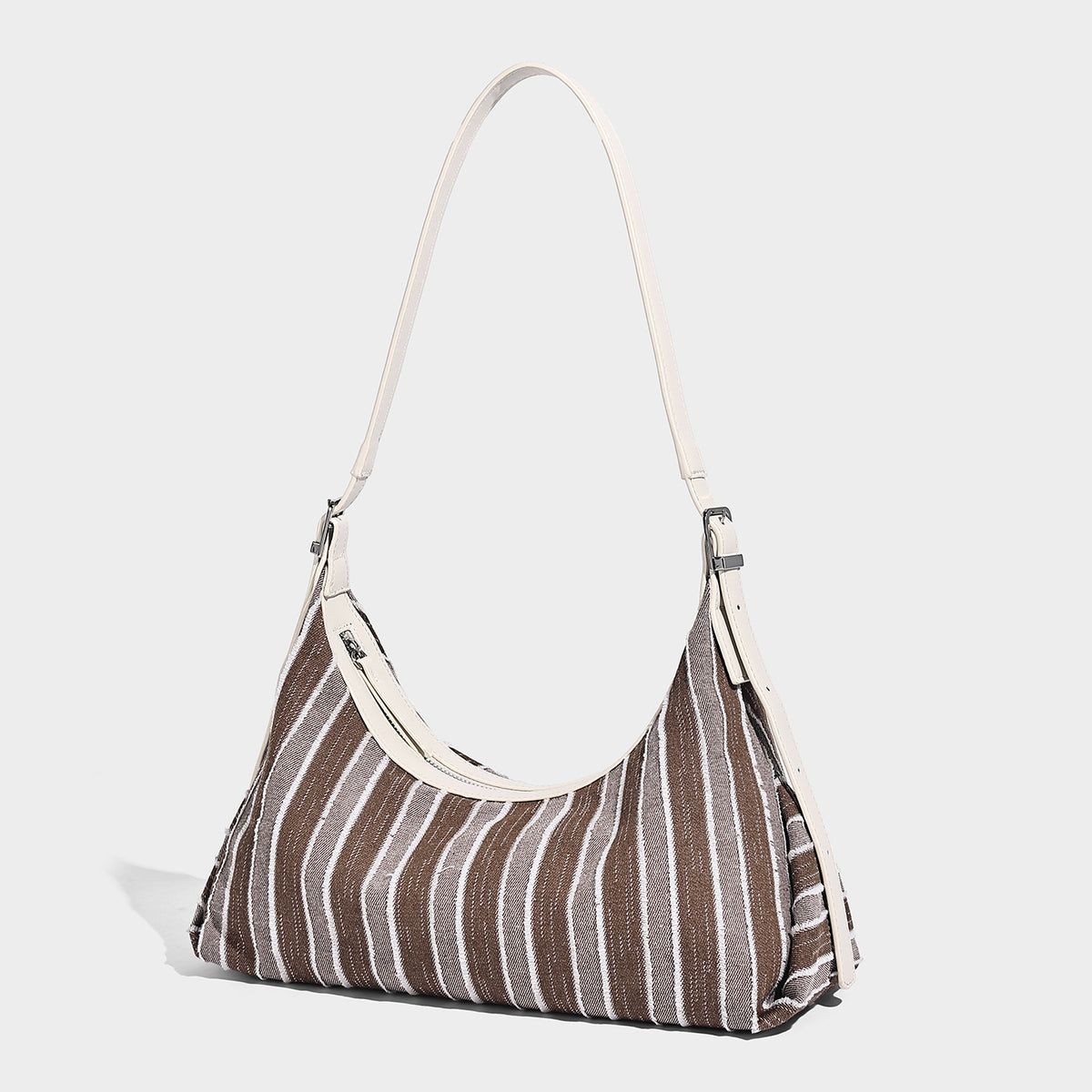 Slouchy striped woven hobo bag with contrast cream trim, top zip closure, and adjustable silver-tone buckle strap, front view