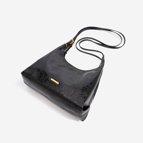 Slouchy hobo shoulder bag in crinkle high-gloss leather-look finish with gold-tone bar hardware and adjustable strap, detail