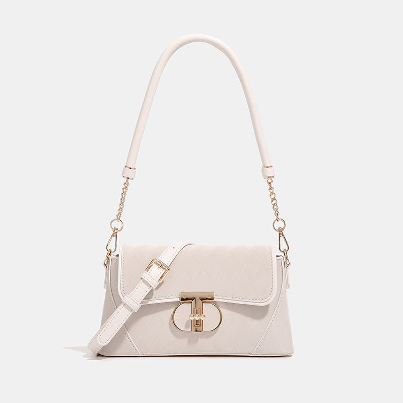 Small structured diamond-quilted flap bag with gold-tone turn-lock closure, chain shoulder strap, and cylindrical top handle