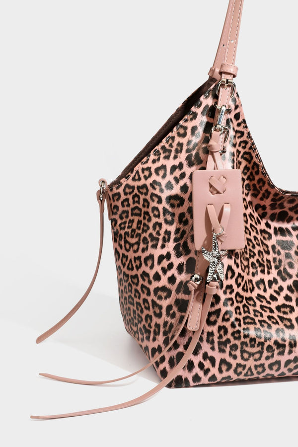 Large leopard print shoulder tote bag with glossy finish, long double straps, front zip pocket, silver-tone hardware, and