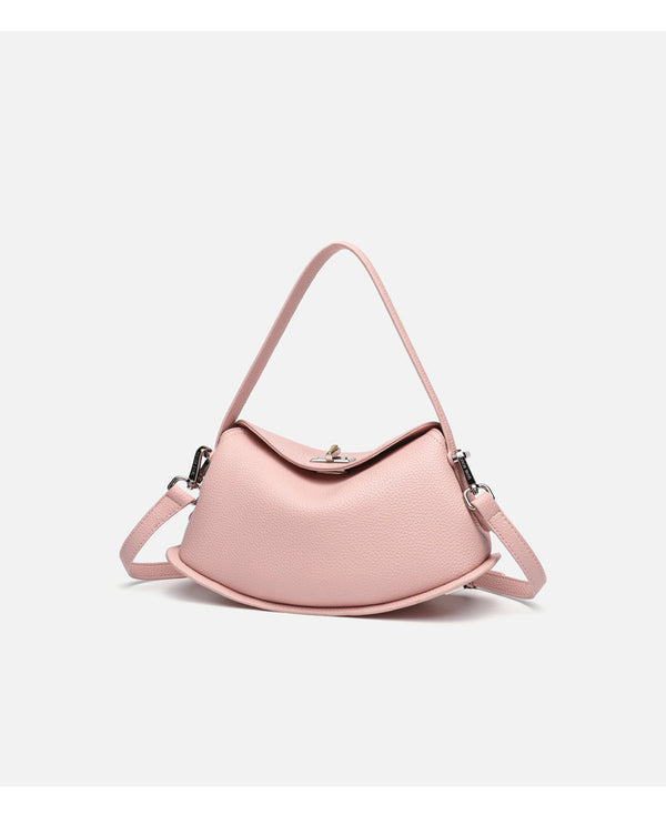 Pebbled leather-look half-moon saddle bag with turn-lock flap closure, top handle, and detachable crossbody strap, detail
