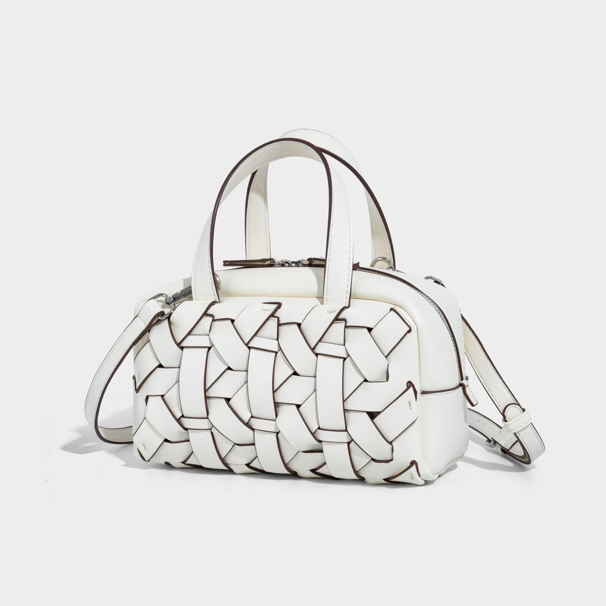 Small structured woven-panel top-handle convertible bag with contrast piping, silver-tone zip closure, and detachable, front
