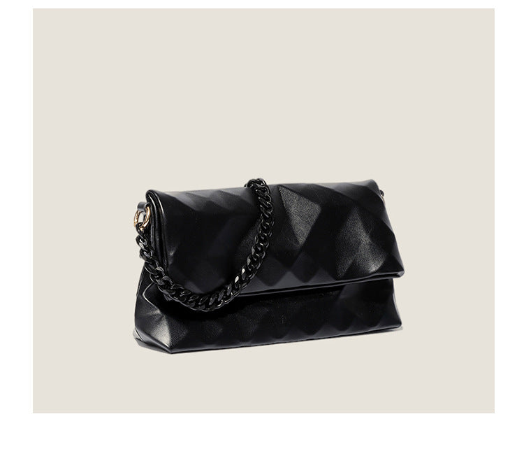 Cream white rectangular flap shoulder bag with geometric faceted surface and chunky tone-on-tone chain strap with gold-tone