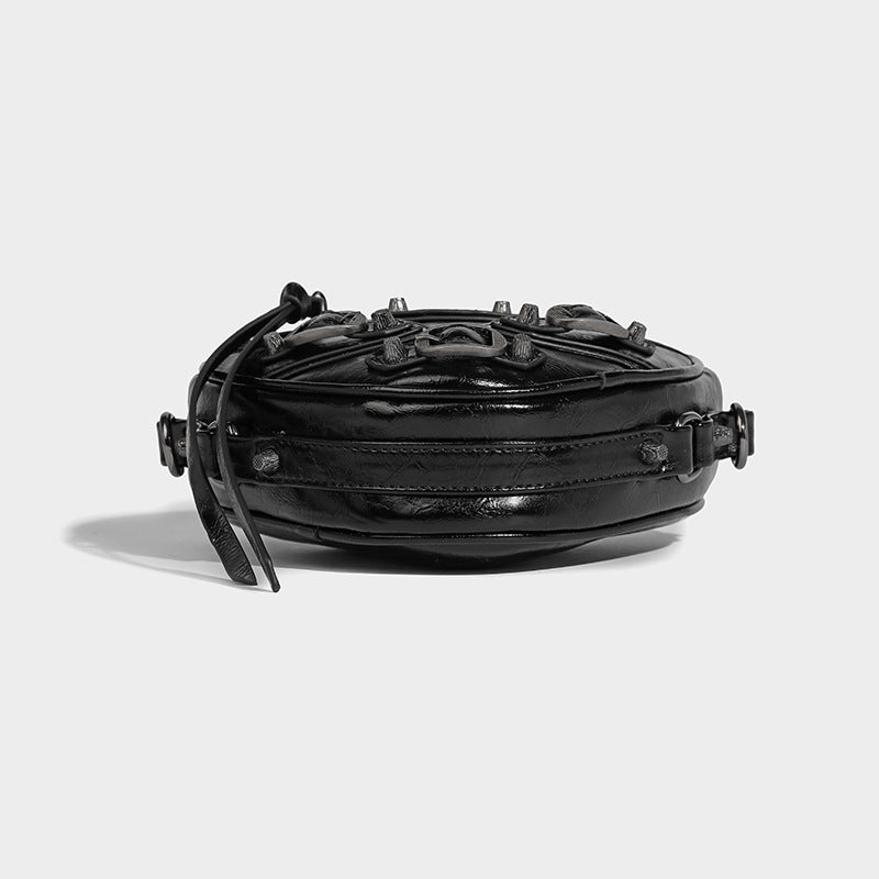 Mini heart-shaped crossbody bag with glossy crinkled finish and moto buckle hardware, detail view 25